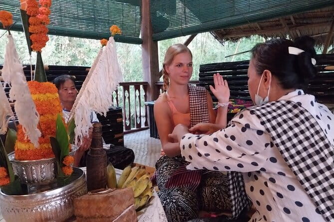 Luang Prabang Cooking, Pottery & Candle Experience - Making candles with flowers and beeswax