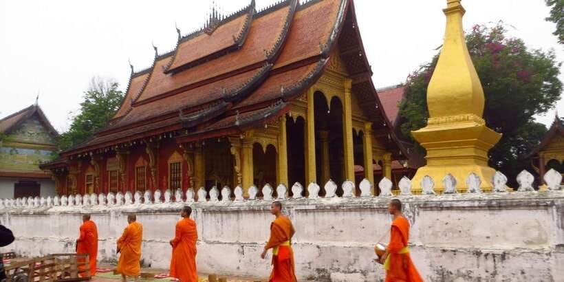 Luang Prabang: Foodie Walking Tour & Monk Blessing - Entering the temple for the monk blessing