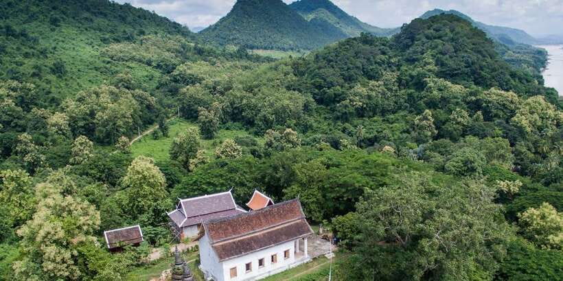Luang Prabang: Pottery Workshop & Wat Chomphet cycling Tour - Riding through Chomphet district