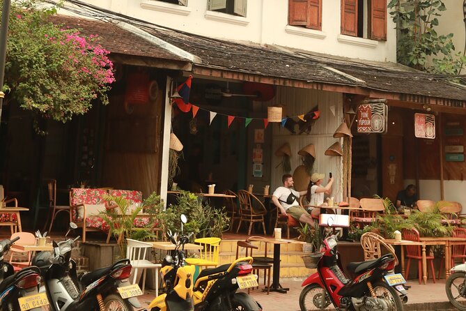 Morning food tour with market Temples option Kuangsi waterfall - Walking through Wat Mai and Wat Sene
