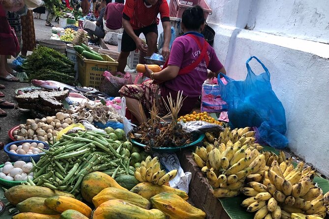 Morning food tour with market Temples option Kuangsi waterfall - The larger experience at Wat Xieng Thong