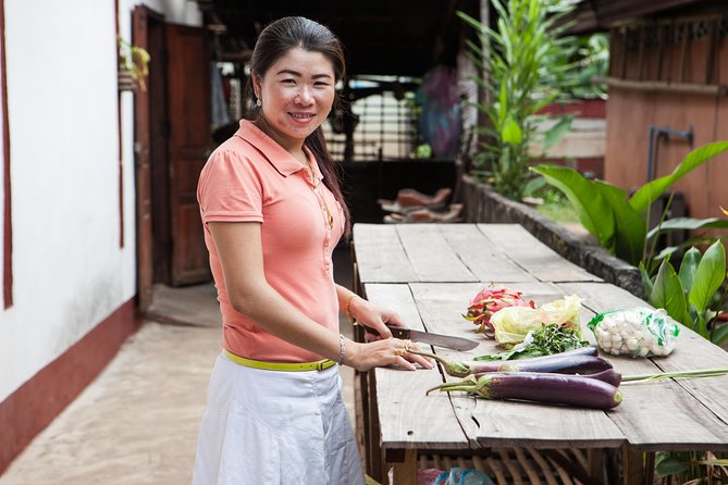 Traditional Market Tour and Private Laotian Cooking Class with a Local - Sharing the meal in a local home